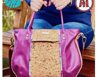 May include: A magenta handbag featuring a central panel of natural cork material, accented by vertical strips of blue and purple patterned fabric. The bag includes two top handles, gold-toned metal hardware, and a detachable shoulder strap.