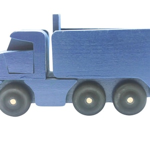 Toy wooden dump truck. What is more fun than a dump truck? This tilting bed truck comes in a choice of colors. Great gift item