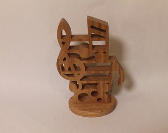 Musical note sculpture handcrafted on a scroll saw from red oak