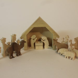 Nativity scene with 15 pieces handcrafted from hardwoods. Includes babyJesus in a manger, Mary, Joseph, shepherds, kings, animals, stable