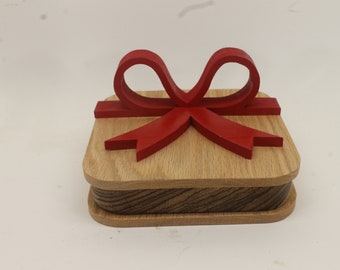 Wooden gift box with attached wooden red bow