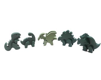 Dinosaur set with a brontosaurus, triceratops, pterodactyl, tyrannosaurus rex, and stegosaurus. Solid wood, painted green