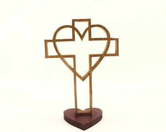 Wooden cross surrounded by a heart, on a heart-shaped base