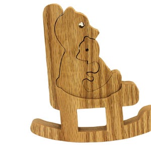Mama and baby bear in a rocking chair. This cute little toy makes a great decoration for a child&#39;s room.