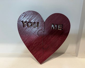 This clever heart puzzle has two pieces, "you" and "me." It is made from Purpleheart wood