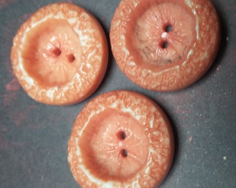 Three Orange Peel Textured Buttons