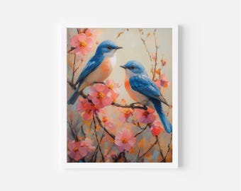 May include: A framed art print depicting two bluebirds on a flowering branch. The birds have blue and orange feathers. The blossoms are pink with yellow centres, set against a soft, painterly background. The artwork is in a white frame.