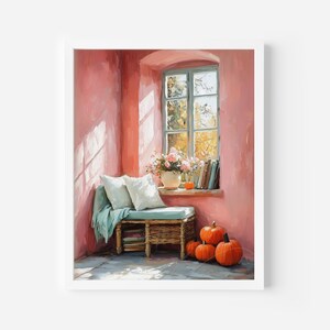 May include: A framed watercolour painting depicting a cosy interior. A window with a view of autumn foliage is the focal point. A bench with cushions and a blanket sits below the window. Pumpkins and flowers add seasonal touches.