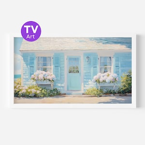 May include: A framed print of a coastal cottage with light blue shutters and door. White hydrangeas bloom in window boxes. The artwork has a soft, painterly style. The text "TV Art" is in a purple circle in the upper left corner.