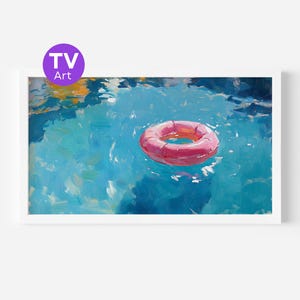 May include: A framed painting of a pool scene with a pink inflatable ring floating on the water. The water is painted in shades of blue and green, with the text "TV Art" in a purple circle in the upper left corner.