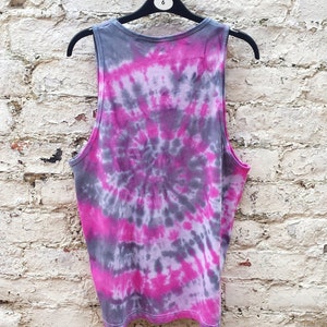 A tie-dye tank top with a pink and gray swirl pattern.