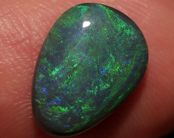 Lightning Ridge Black Opal with Green swirls of color 2.6 Carats 12 x 19 x 3.5mm Fantastic ring or pendant stone. Solid N2 Black Opal