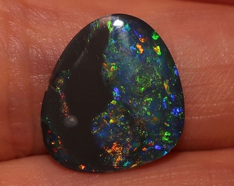 Beautiful Lightning Ridge Black Opal with Bright Rainbow Multi colors. Grea ring or pendant stone  2.55 Carats 16 x 13 x 2mm