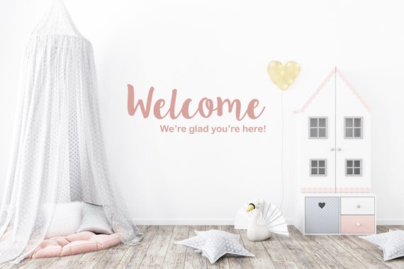 We're Glad You're Here Wall Decal