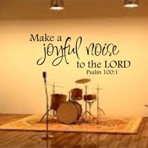 May include: A drum set in a room with a wall quote that reads "Make a joyful noise to the LORD Psalm 100:1".