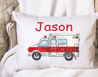 May include: White pillow with a red and white ambulance illustration and the name "Jason" in red lettering.