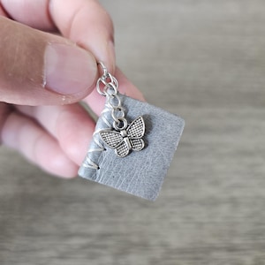 Handcrafted Leather Book Pendant – Miniature Necklace with Recycled Book Pages Featuring Butterfly Charm | perfect for book lovers