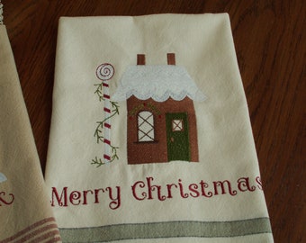 Cotton kitchen towel embroidered with a gingerbread house
