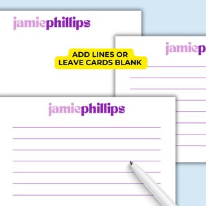 May include: White notepads with purple lined pages and the name "jamiephillips" in a gradient purple font. One notepad has a pen resting on it. Text on a yellow banner reads "ADD LINES OR LEAVE CARDS BLANK".