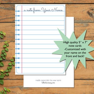 May include: White note cards with blue lines and a red margin, resembling notebook paper. The text "a note from Your Name" is at the top. The cards are 5" x 7" and can be customized with a name on the front and back.