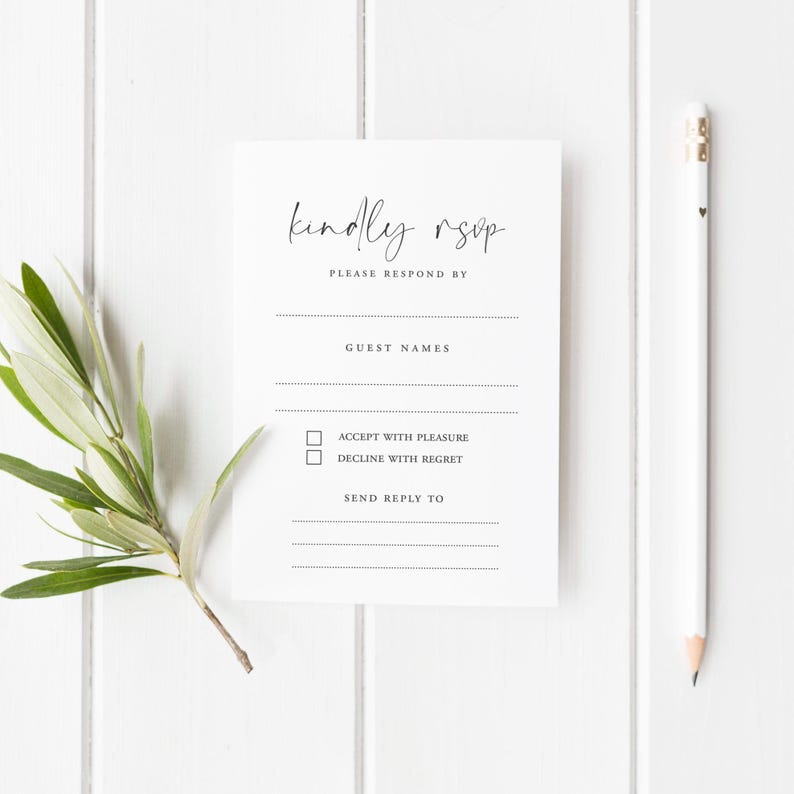 Minimalist printed RSVP card with the phrase “Nothing Fancy Just Reply!” in black modern typography, designed with fill-in-the-blank details for guest names, attendance, acceptance, dietary needs, and more. The card is placed on a white wooden background styled with white ranunculus flowers, gold vintage scissors, silk ribbon, and wooden spools – ideal for casual weddings, elopements, and budget-friendly celebrations with a simple, modern touch.