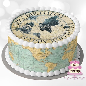 May include: A round cake decorated with a vintage world map and the text "Happy Birthday" around the edge. The cake is frosted with white icing and has a white cake board.