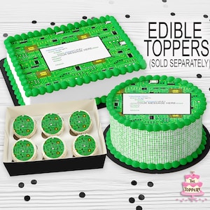 May include: A set of edible cake toppers featuring a green circuit board design with the text "YOUR MESSAGE HERE" in a white box. The toppers are sold separately and include a round cake topper, cupcake toppers, and a rectangular cake topper.