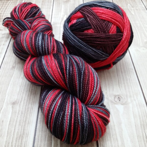 Hand dyed self striping "Dark Horse" twisted merino sock yarn