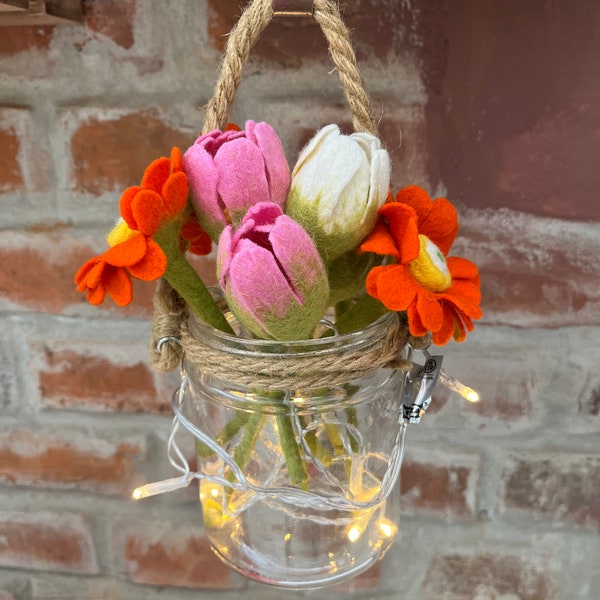 Hanging glass with colorful spring flowers, decoration for the home, or to give as a gift