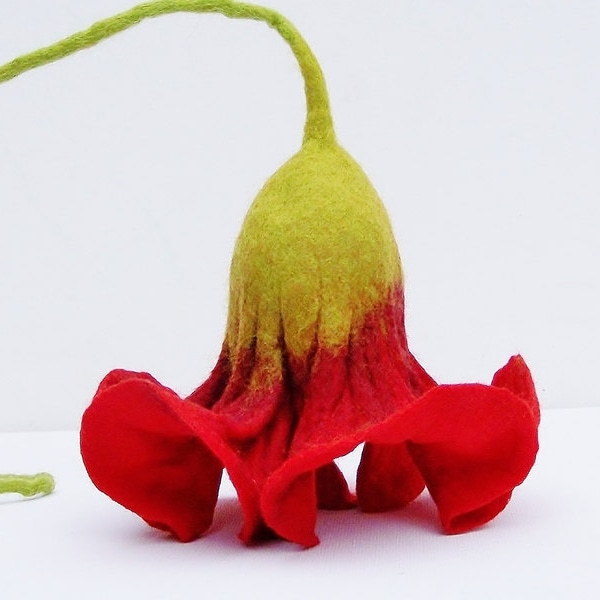 Red hanging flowers felted by hand for the window, or as decoration in the apartment