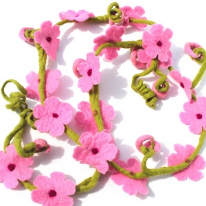 Glamorous tender little red poppy garland. A decoration for the inconspicuous lamp or the window sill
