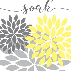 May include: A printable wall art design with the word "soak" in cursive script. The background features a pattern of overlapping gray and yellow stylized flower shapes.