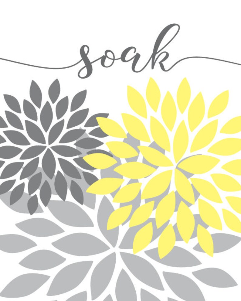 May include: A printable wall art design with the word "soak" in cursive script. The background features a pattern of overlapping gray and yellow stylized flower shapes.