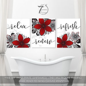 May include: Three bathroom wall art prints with red and gray floral designs. The prints feature the words "relax", "renew", and "refresh".