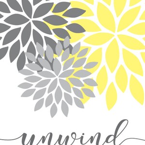 May include: A white background with three overlapping gray and yellow floral designs. The text "unwind" is written in gray cursive at the bottom of the image.