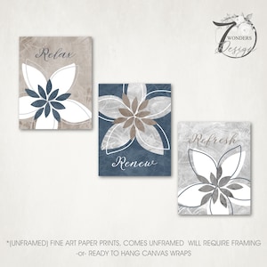 May include: Set of three unframed canvas prints with a floral design in shades of blue, brown, and white. The prints feature the words "Relax", "Renew", and "Refresh".