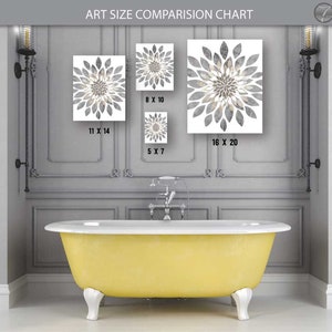 May include: A comparison chart showing different sizes of art prints featuring a gray and white floral design. The chart shows the prints in a bathroom setting above a yellow bathtub.
