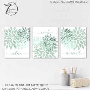 May include: Three unframed prints with watercolor-style green floral designs and the words "relax", "soak", and "unwind" on a white background.