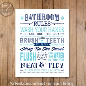 May include: A white bathroom rules sign with blue and light blue text. The sign says "Bathroom Rules" and lists rules such as "Wash your hands", "Brush your teeth", "Floss", "Hang up the towel", "Flush the water", "Be neat and tidy", and "Turn off the lights".