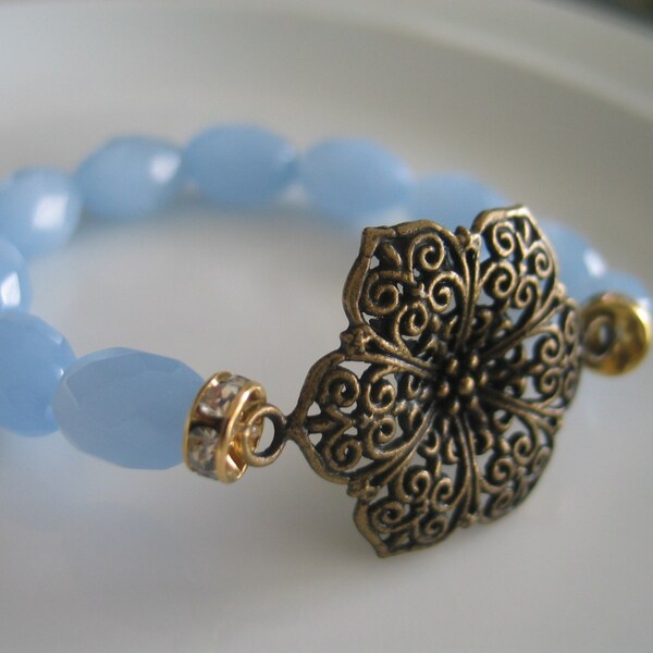 Bronze toned rose sculpted pendant elastic bracelet with light blue multifaceted shiny beads, birthday gift, bronze bracelet, bronze flower