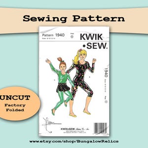 May include: Kwik Sew sewing pattern 1940, featuring illustrations of two figures in athletic wear. The pattern is uncut and factory folded. The text "Sewing Pattern" is at the top, with "UNCUT Factory Folded" in an oval below.