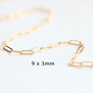 May include: A gold chain necklace with a 9 x 3 mm link pattern.