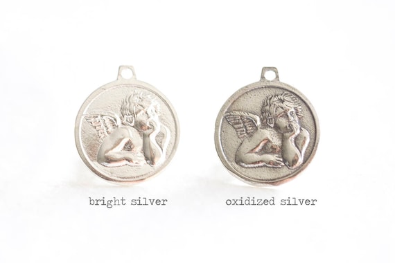 Sterling silver cupid disc pendant Sterling silver cupid disc pendant