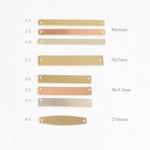 May include: Four rows of metal rectangular and oval blank tags with holes for hanging. The tags are in gold, rose gold, and silver. The tags are labeled with numbers and measurements in millimeters.  The top row is labeled 1-1, 1-2, 1-3 and measures 40x4mm. The second row is labeled 2-1 and measures 38x7mm. The third row is labeled 3-1, 3-2, 3-3 and measures 30x5.2mm. The bottom row is labeled 4-1 and measures 27x6mm.