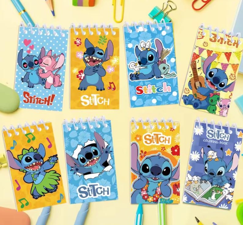 May include: A collection of spiral-bound notebooks featuring the character Stitch from the Disney movie Lilo & Stitch. Each notebook has a different design, with Stitch in various poses and settings, and the word "Stitch" is printed on each cover.