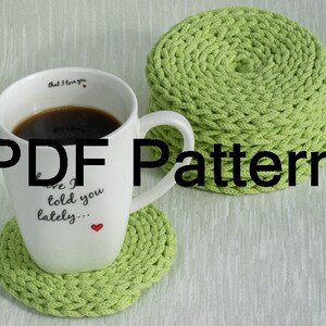 May include: A PDF pattern for crocheting green coasters. The pattern includes instructions for making a set of four coasters. The coasters are made with a simple stitch and are perfect for adding a touch of handmade charm to your home.