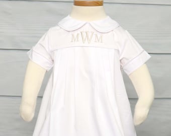 May include: White baby gown with a Peter Pan collar and short sleeves. The gown features a pleated front and is adorned with embroidered initials. The sleeves and collar are trimmed with a light gray piping. The gown is displayed on a mannequin.