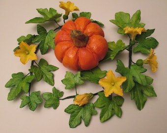 handmade pumpkin cake topper with flowers and leaves sugar gum paste