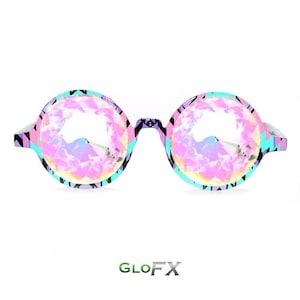 May include: Round kaleidoscope glasses with a pink, blue, and black geometric pattern. The lenses are clear and have a kaleidoscope effect.