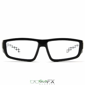 May include: Black rectangular framed glasses with clear lenses and a dotted pattern on the inside of the lenses.